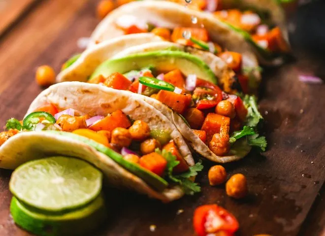 Tacos at Casa Verde — lime being squeezed over farm-to-table tacos