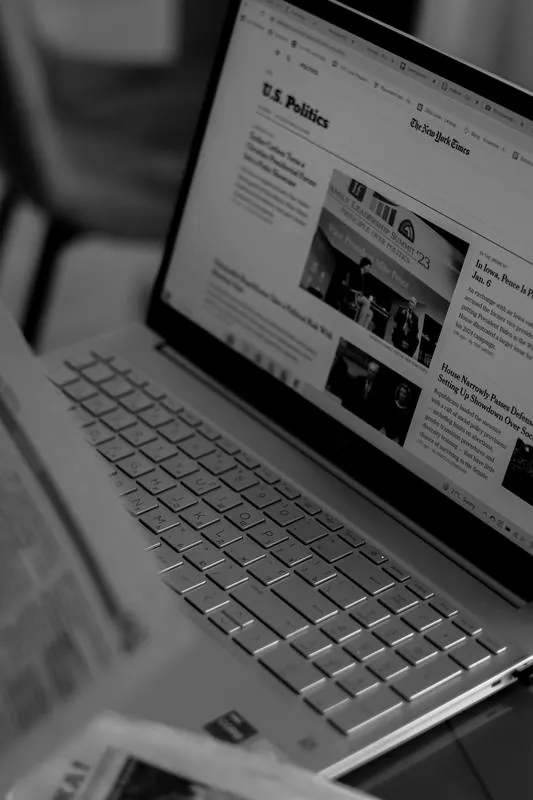 Reading news on a laptop